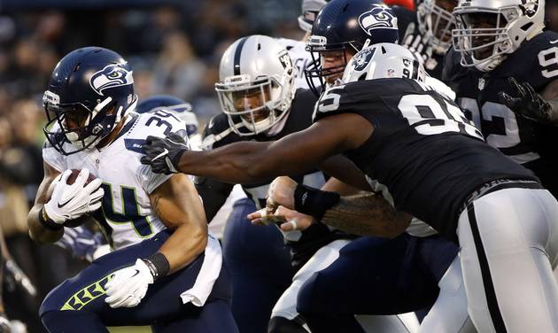 Seattle Seahawks running back Thomas Rawls runs against the Oakland Raiders during the first half of a preseason NFL football game Thursday Sept. 1 2016 in Oakland Calif