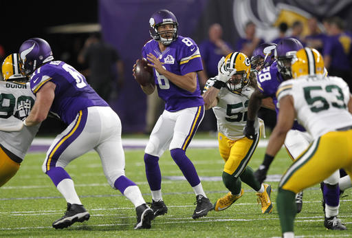 Minnesota Vikings quarterback Sam Bradford throws a pass during the first half of an NFL football game against the Green Bay Packers Sunday Sept. 18 2016 in Minneapolis