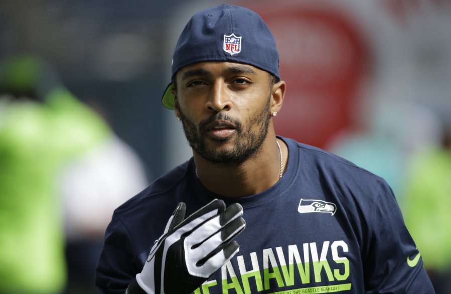 Seattle Seahawks wide receiver Doug Baldwin stands on the field during warmups before an NFL football game against the Miami Dolphins Sunday Sept. 11 2016 in Seattle