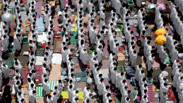 Muslim pilgrims pray outside Namira Mosque