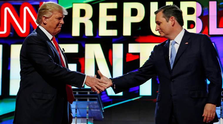 Donald Trump and Ted Cruz shake hands at the start of the Republican candidates debate sponsored by CNN at the University of Miami in Miami Florida