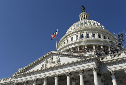 An American flag flies over Capitol Hill in Washington Tuesday Sept. 6 2016 as lawmakers return from a 7-week break. Election-year politics will rule the congressional calendar when lawmakers return from a seven-week recess