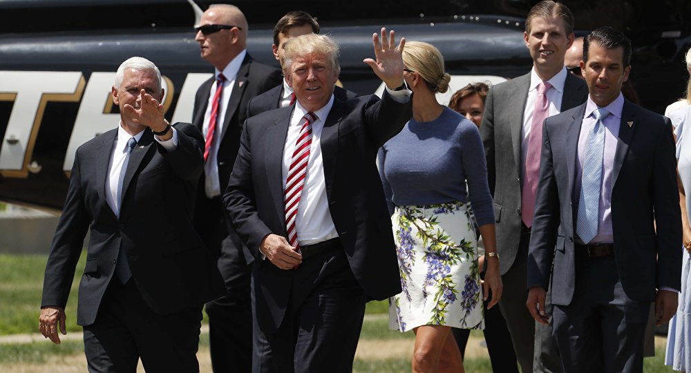 Republican U.S. presidential nominee Donald Trump walks with vice presidential candidate Mike Pence and family members after arriving for an event on the sidelines of the Republican National Convention in Cleveland Ohio U.S