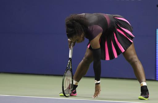 Serena Williams catches her balance after a serve from Karolina Pliskova of the Czech Republic