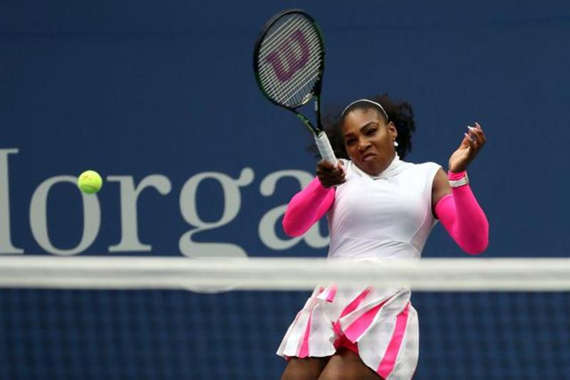 Serena Williams of the United States hits a forehand against Yarolslava Shvedova of Kazakhstan