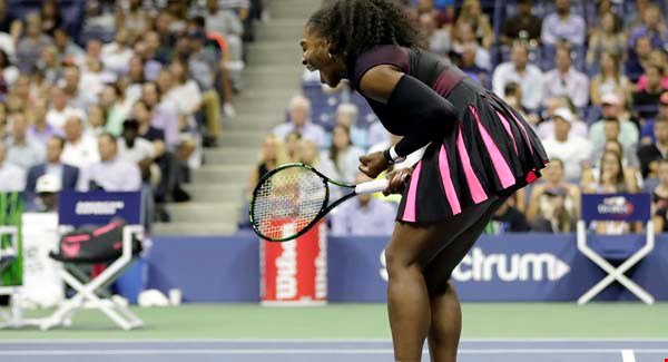 Serena Williams reacts after winning a point against Vania King