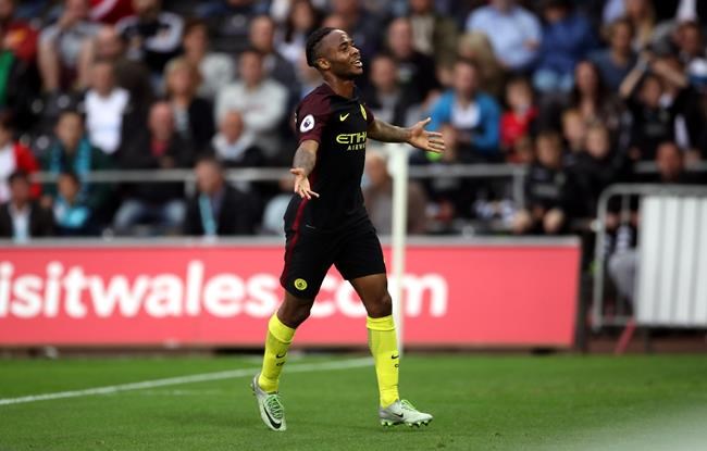 Manchester City's Raheem Sterling celebrates after scoring his side's third goal during their English Premier League soccer match against Swansea at The Liberty Stadium Swansea England Saturday Sept. 24 2016