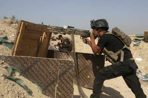 Iraqi counter-terrorism forces face off against Islamic State militants in the Nuaimiya neighborhood of Fallujah Iraq on June 1