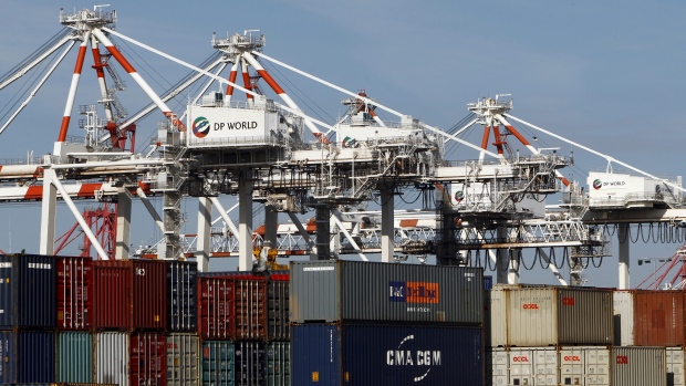 Shipping containers and cranes are seen at a port holding yard in Melbourne in this June 2010