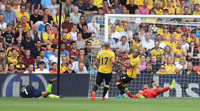 Arsenal's Alexis Sanchez bottom left scores his side's second goal during the English Premier League soccer match between Watford and Arsenal at Vicarage Road Watford England on Saturday