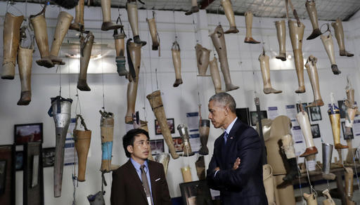 U.S. President Barack Obama right tours Cooperative Orthotic and Prosthetic Enterprise Visitor Centre in Vientiane Laos Wednesday Sept. 7 2016