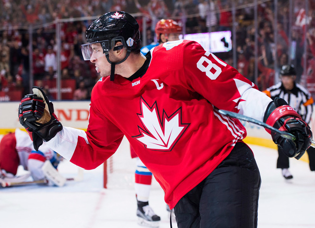 Sidney Crosby celebrated after scoring a first-period goal during Saturday's game in Toronto. Click