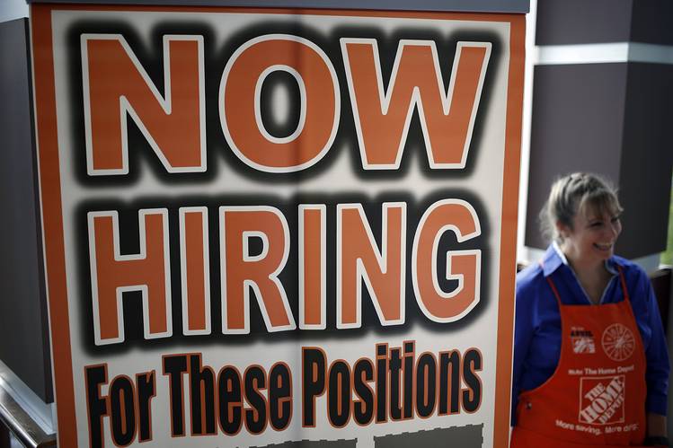 A recruiter from The Home Depot at a job fair in Cleveland on Thursday. August job growth fell short of expectations but remained respectable