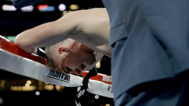 Smith recovers on the ropes after being stopped by a body shot in the ninth round by Mexican star Alvarez