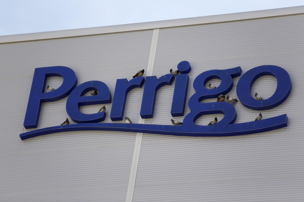 Birds are seen on the logo of generic drugmaker Perrigo Co outside their new factory in the city of Yeruham in southern Israel