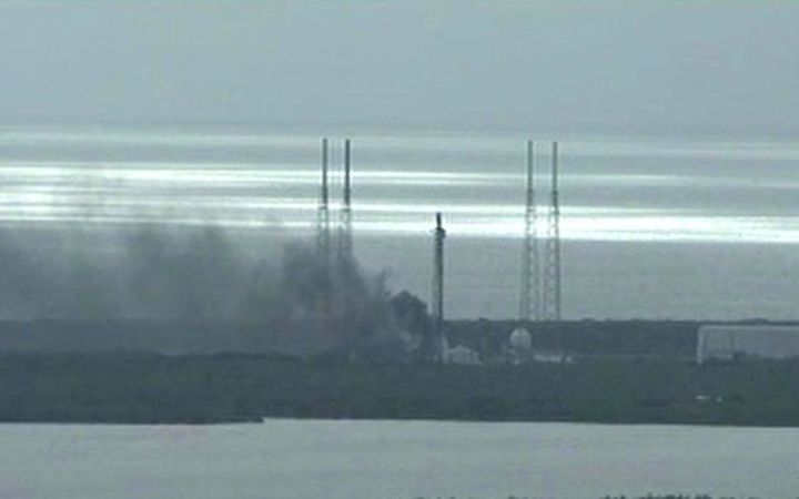 Smoke billows from the SpaceX launch site. Reuters via NASA TV