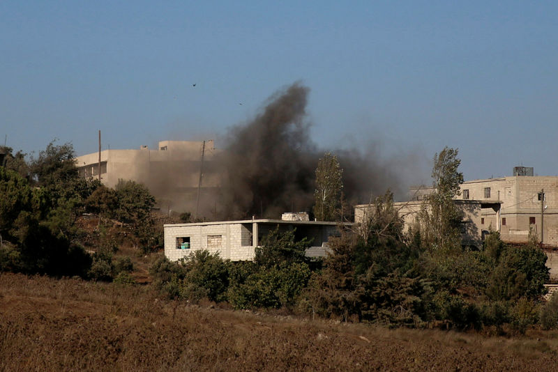 Smoke rises due to shelling on the rebel controlled town of Jubata al-Khashab in Quneitra countryside Syria