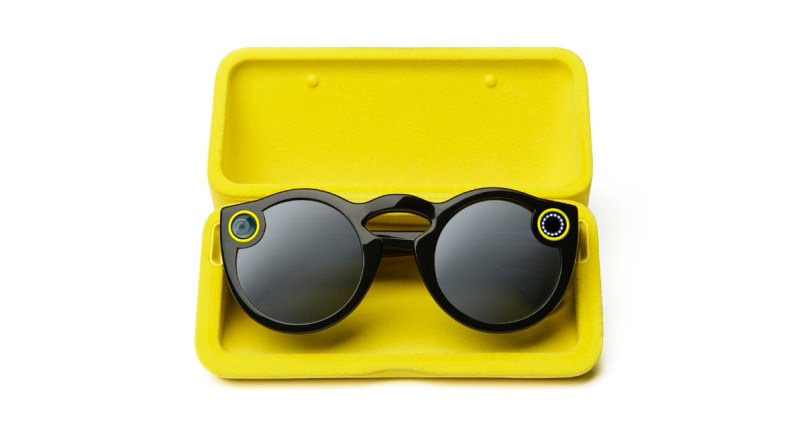 Yellow charging case with Spectacles sitting in them