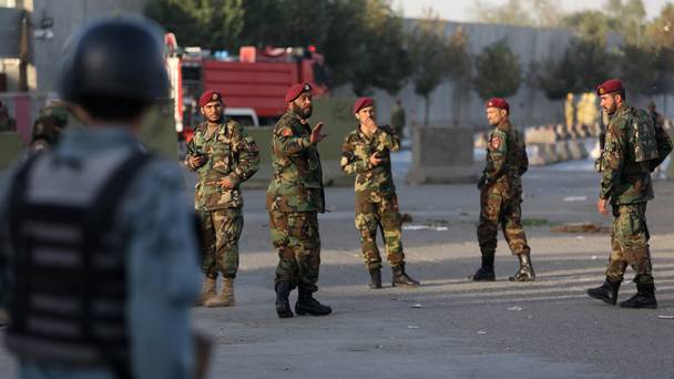 Soldiers and police at the scene of a suicide attack in Kabul