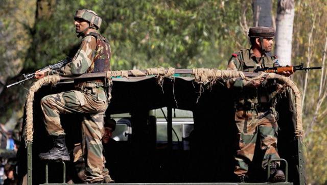 Soldiers guard outside the army base which was attacked by militants in Uri Jammu and Kashmir