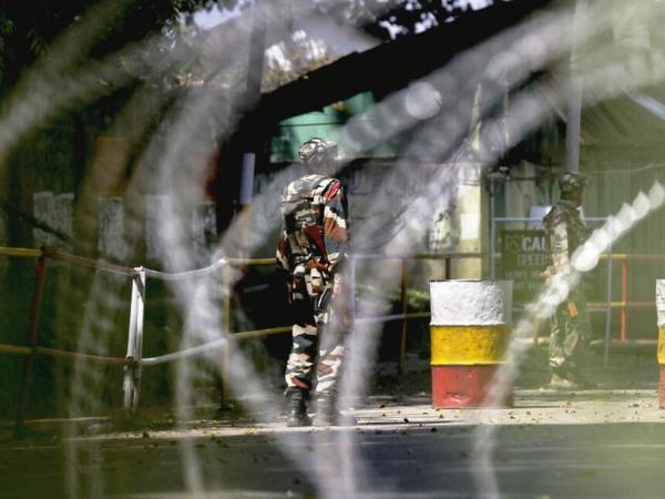 Soldiers guard the army base which was attacked by militants in Uri west of Srinagar on Sunday. AP