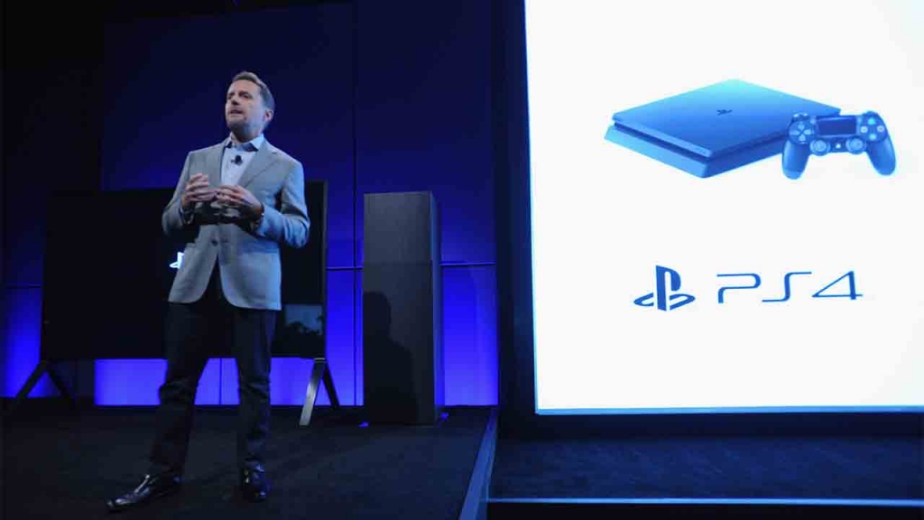 NEW YORK NY- SEPTEMBER 07 Andrew House President and Global CEO of Sony Interactive Entertainment presents the slimmer and lighter new Play Station 4 onstage at Play Station Meeting 2016 at Play Station Theater