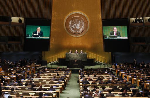 United Nations Secretary General Ban Ki-moon speaks as President of the 71st session of the General Assembly Peter Thomson center and Mogens Lykketoft President of the 70th session of the General Assembly look on during the opening of a summit addressi