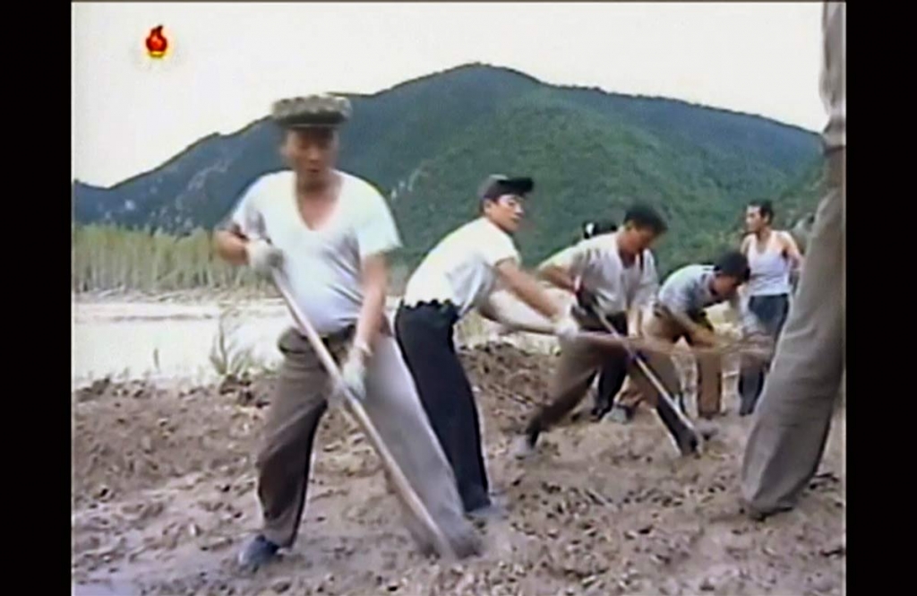 In this undated image from video distributed on Monday Sept. 12 2016 by North Korean broadcaster KRT North Korean workers build levees along a river bank