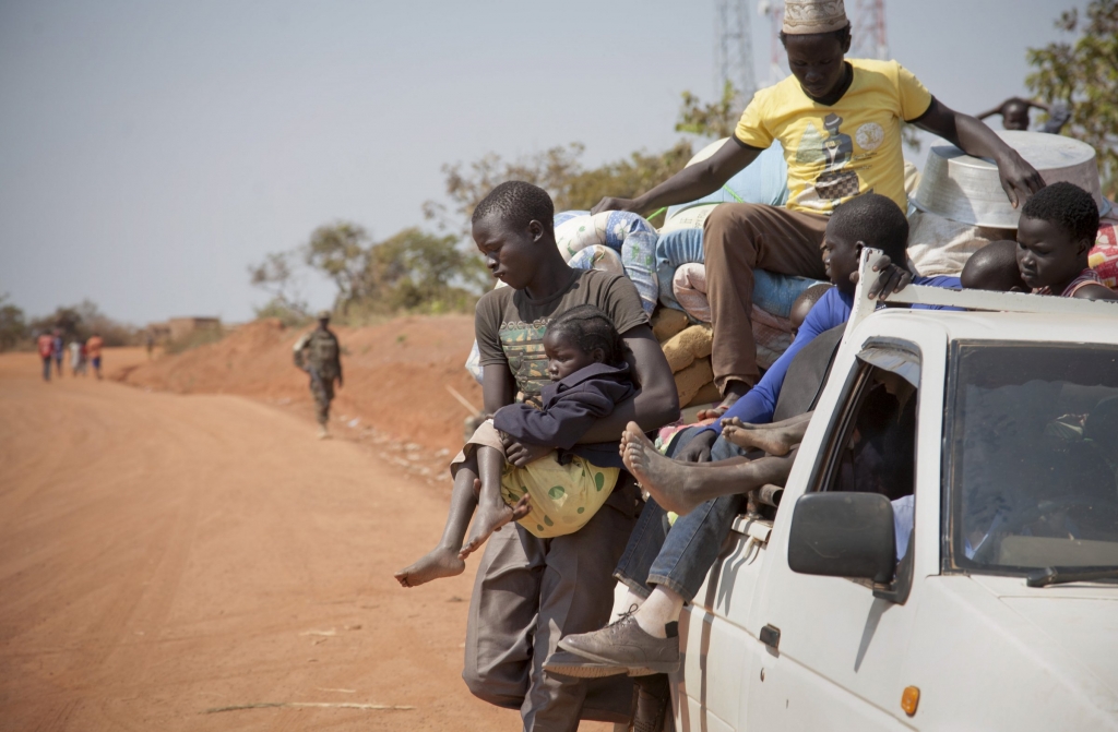 Refugees who fled the recent violence in South Sudan and crossed the border into Uganda arrive and await transportation from a transit center in the town of Koboko Uganda