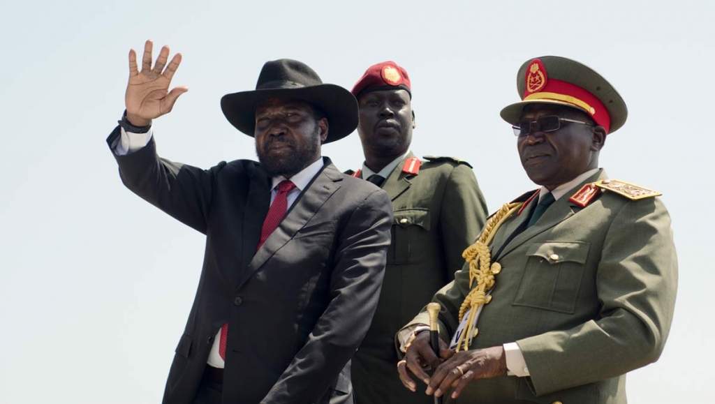 South Sudan's President Salva Kiir left accompanied by army chief of staff Paul Malong right waves during the independence day ceremony in the capital Juba South Sudan