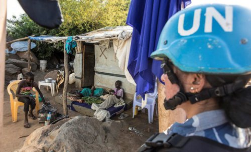 UN peacekeeper keeps watch inside a Protection of Civilians sites in Juba as a UN Security Council delegation meets with the IDPs on 3 September 2016