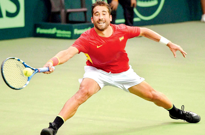 Spain's Marc Lopez returns against India’s Sumit Nagal during the Davis Cup match at RK Khanna Stadium in New Delhi yesterday. Pic  PTI