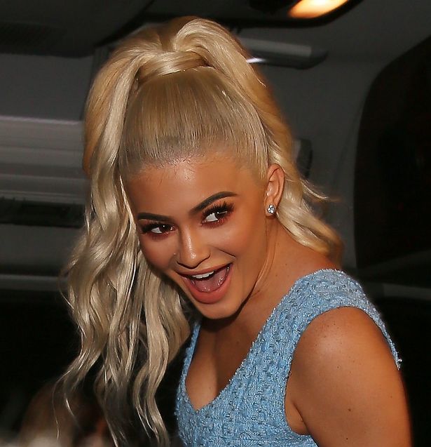 Kylie Jenner has a big smile on her face after getting stuck in a elevator and being rescued by firemen