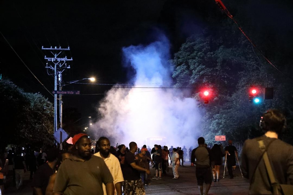 For a second night protests over a deadly officer-involved shooting in Charlotte North Carolina turned violent with police firing tear gas and demonstrators throwing objects and trying to damage vehicles