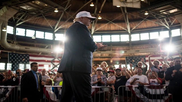 Republican presidential nominee Donald Trump walks on stage to speak at the 2nd annual Joni Ernst Roast and Ride event