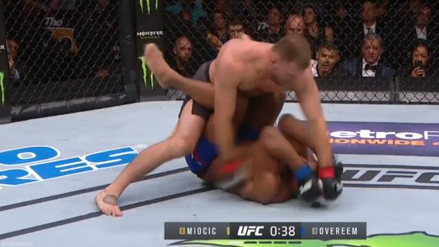 Miocic retains belt with brutal knockout