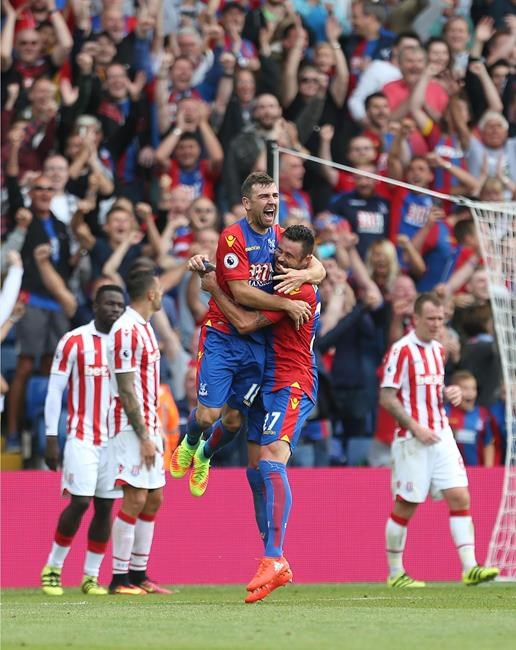 Crystal Palace's James McArthur center left celebrates scoring his side's third goal of the game during their English Premier League soccer match against Stoke City at Selhurst Park London Sunday Sept. 18 2016