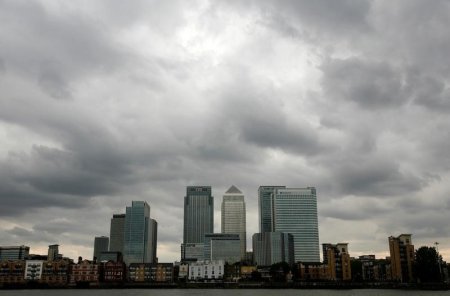 Storm clouds are seen above the Canary Wharf financial district in London Britain