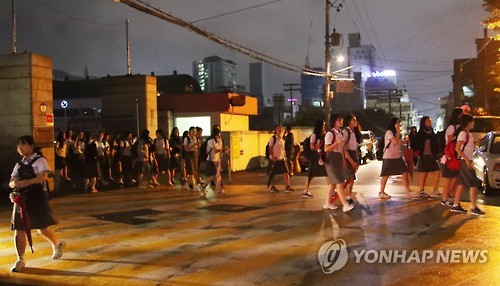 Students evacuate from a school in the southern city of Ulsan on Sept. 12 2016