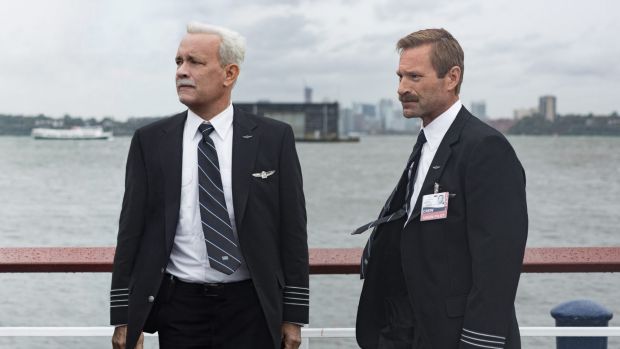 Tom Hanks as Chesley Sullenberger and Aaron Eckhart as Jeff Skiles in Sully a film about the US Airways pilot