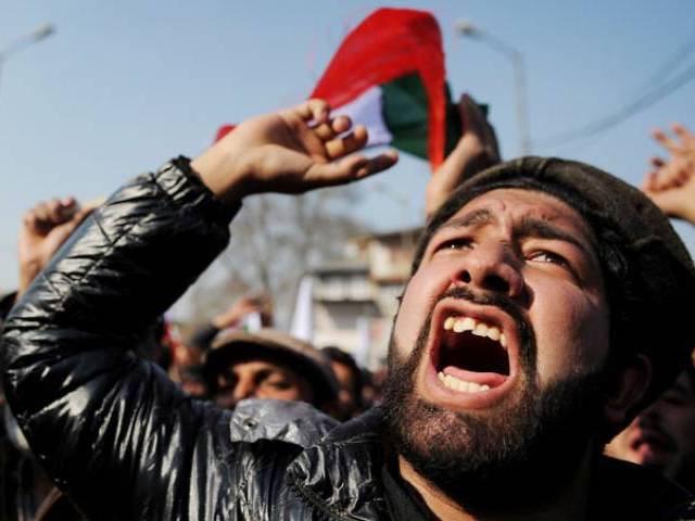 Supporters of the Jammu and Kashmir Libration Front shout pro-freedom slogans during a protest in Srinagar on January