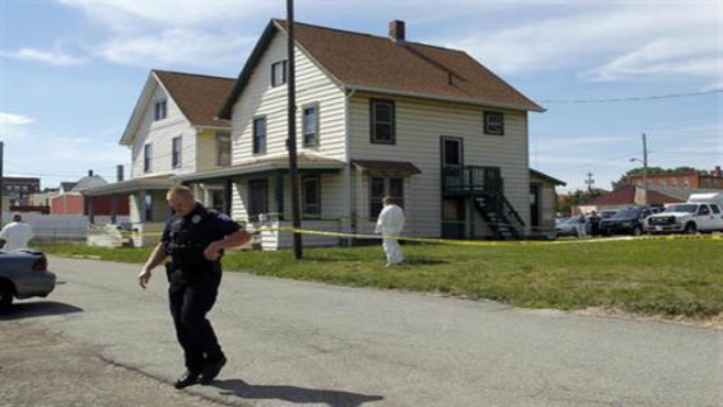 Ashland Police Department and Ohio BCI execute a search warrant on a home on Tuesday Sept. 13 2016 in Ashland Ohio. Authorities say a woman reported being held captive leading to the arrest of a kidnapping suspect a murder confession and the discove