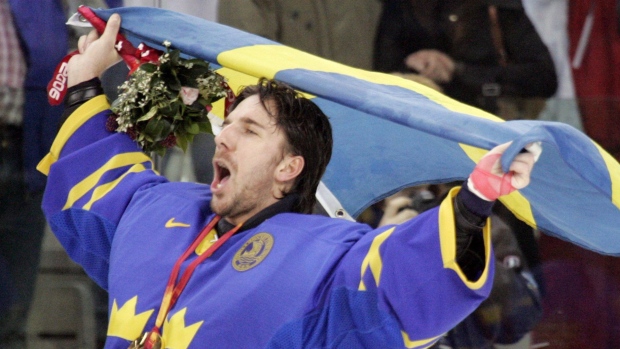 Sweden's goalie Henrik Lundqvist celebrates winning gold at the 2006 Olympics