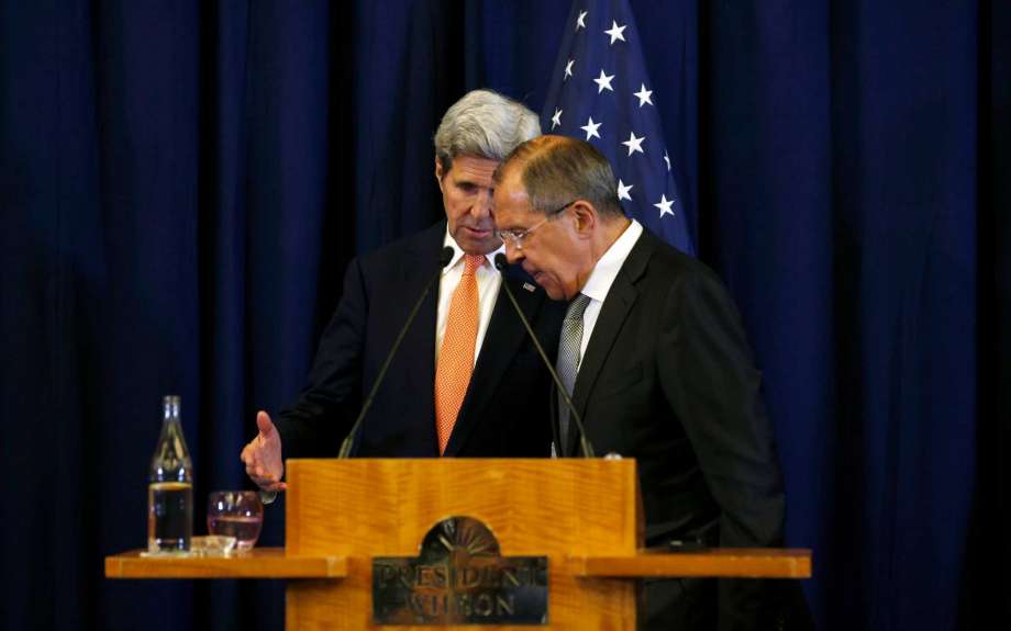 U.S. Secretary of State John Kerry left and Russian Foreign Minister Sergei Lavrov confer at each other at the conclusion of a joint press conference following their meeting to discuss the crisis in Syria in Geneva Switzerland Friday Sept. 9 2016