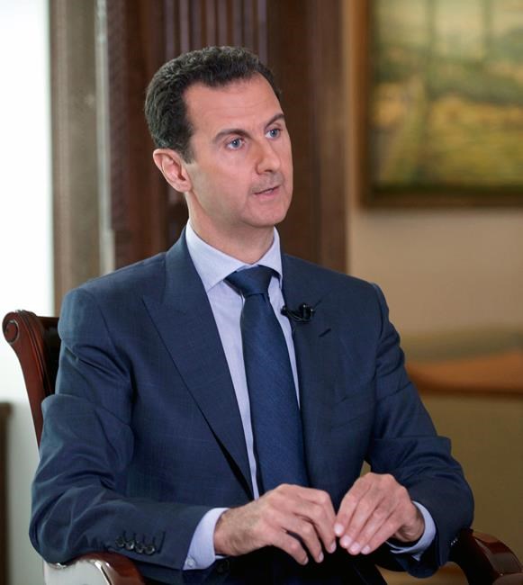 Syrian Presidency Syrian President Bashar Assad speaks to The Associated Press at the presidential palace in Damascus Syria. Assad said U.S. airstrikes on Syrian troops in the country