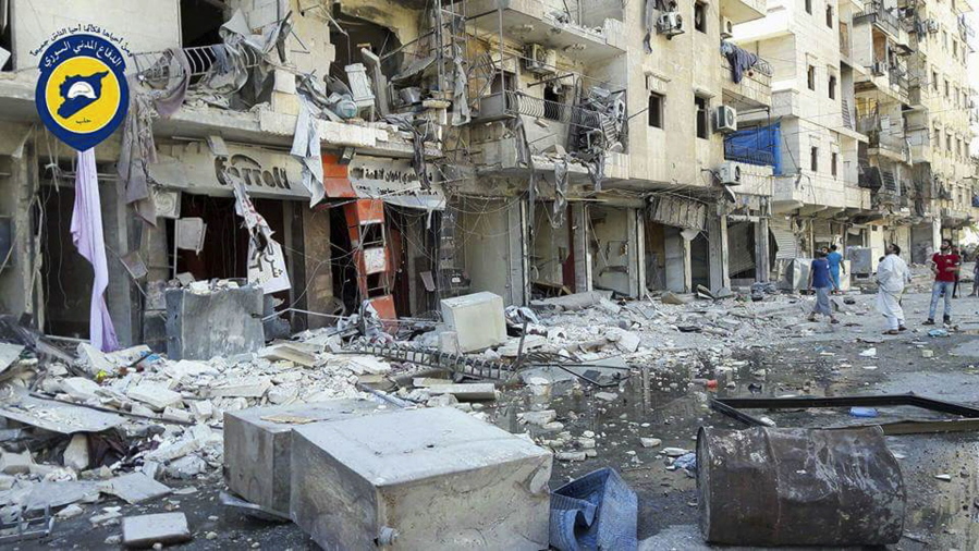 Syrian Civil Defense personnel stand in rubble after airstrikes Sept. 9 in eastern Aleppo Syria