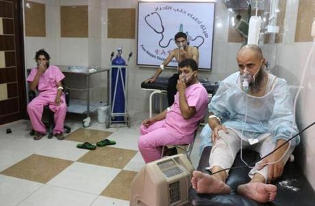 Syrians suffering from breathing difficulties were treated at a makeshift hospital in Aleppo after regime helicopters dropped barrel bombs containing chlorine on the rebel-held Sukkari neighborhood of the northern Syrian city on Tuesday