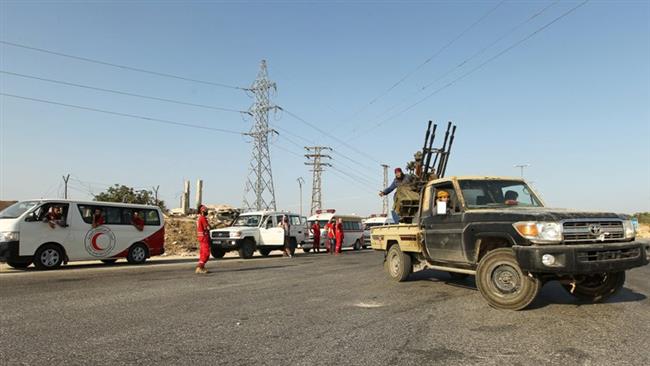 Civilians and militants who were evacuated from the besieged Damascus suburb of Darayya arrive in the militant-controlled town of Idlib