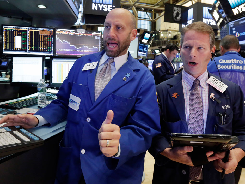 Traders work on the floor of the New York Stock Exchange