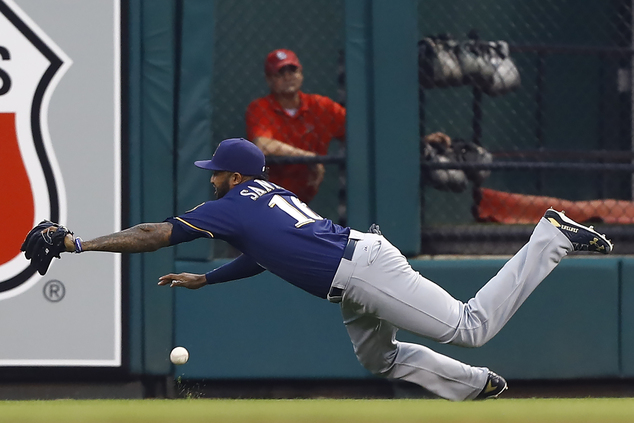 Milwaukee Brewers right fielder Domingo Santana cannot come up with a ball hit for a double by St. Louis Cardinals Matt Carpenter during the first inning